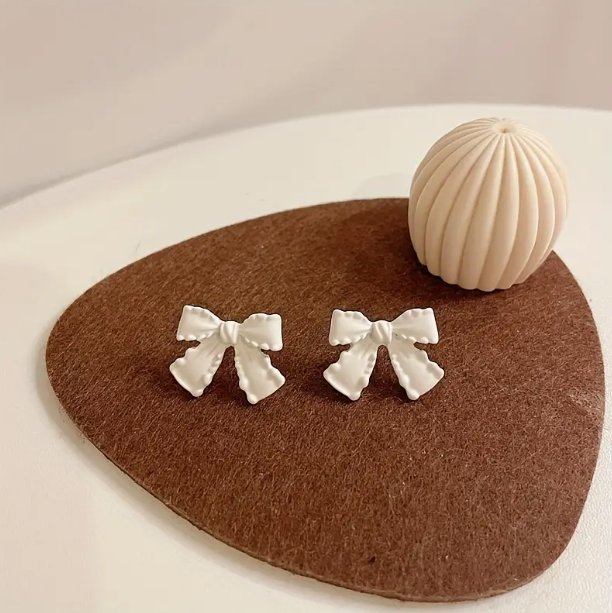 White Bow Stud Earrings image 0