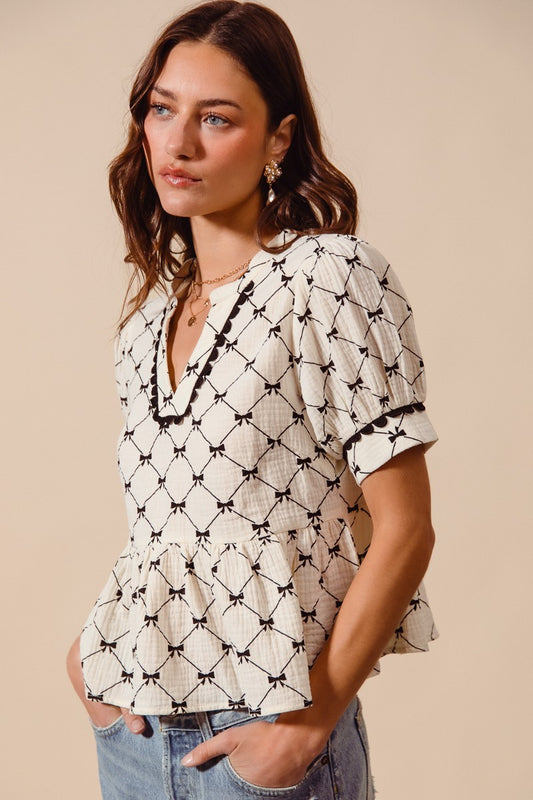 BOW RIBBON PRINTED COTTON GAUZE PEPLUM TOP WITH TRIM image 0
